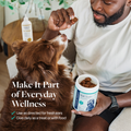 Man giving dog Gut Health supplement treat, promoting everyday pet wellness with daily digestive support
