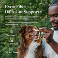 Man giving dog daily soft chew for extra fiber and gut support in outdoor setting
