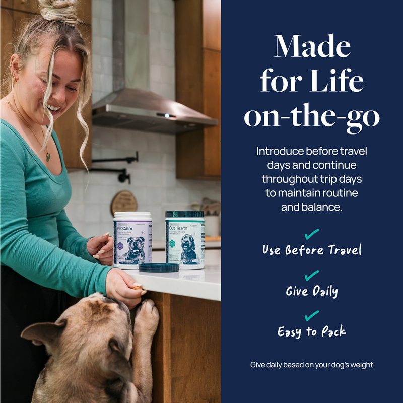 Woman giving dog supplement in kitchen with Pet Calm and Gut Health bottles, ideal for travel and daily use