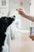 Black and white dog receiving Pet Calm soft chew from owner for calm behavior support